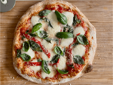 Homemade pizza on a wooden board